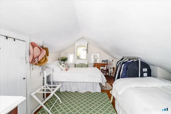 a bedroom with two beds and a window
