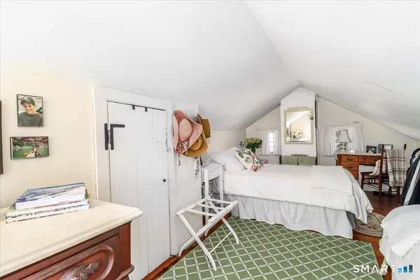 a bedroom with a bed and a table