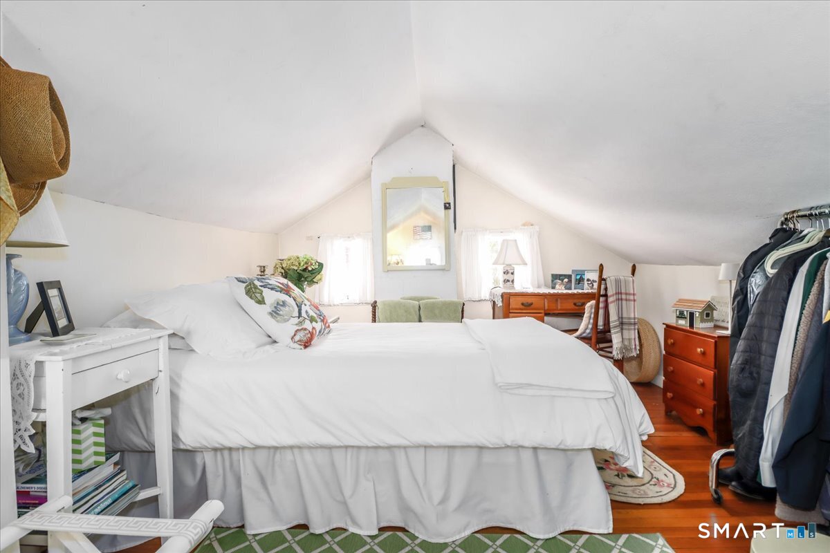 3 Gelston Road Sherman, CT 06784 - Photo 23 of 36 a bedroom with a bed a mirror and dresser