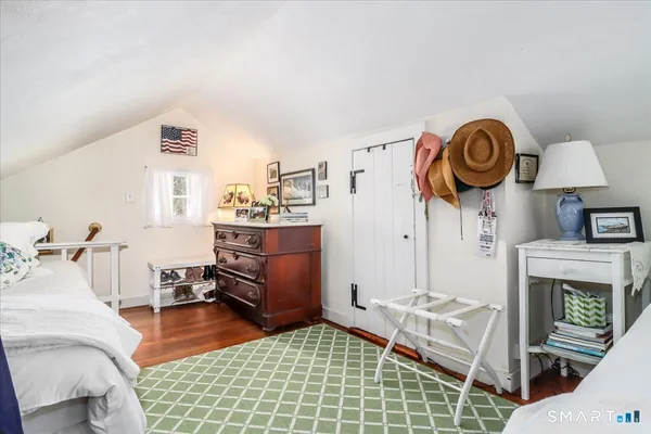 a living room with furniture a fireplace and a table