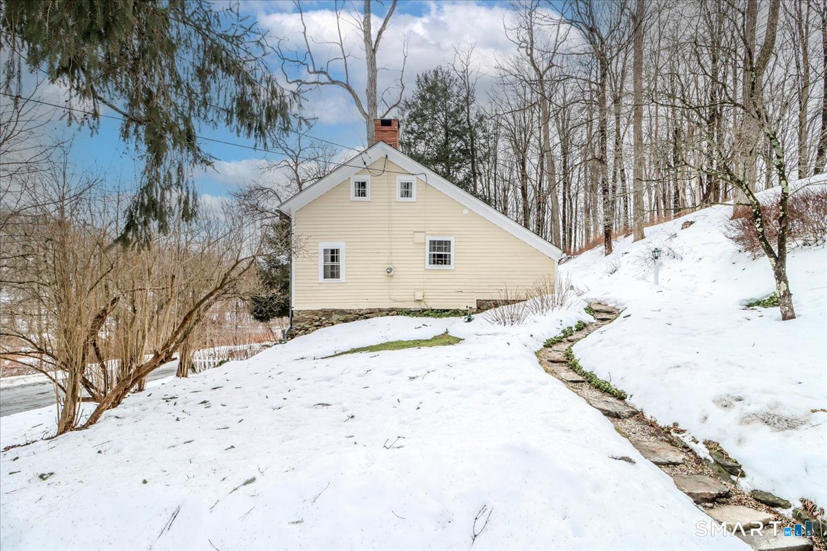 3 Gelston Road Sherman, CT 06784 - Photo 6 of 36 a view of white house with a yard covered in snow