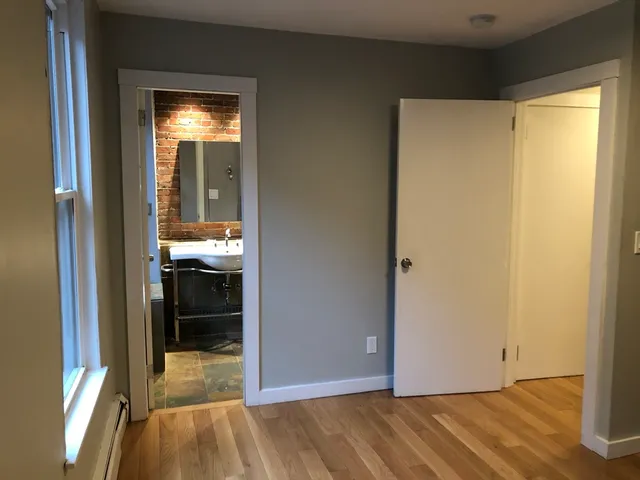 a view of a bedroom from a hallway