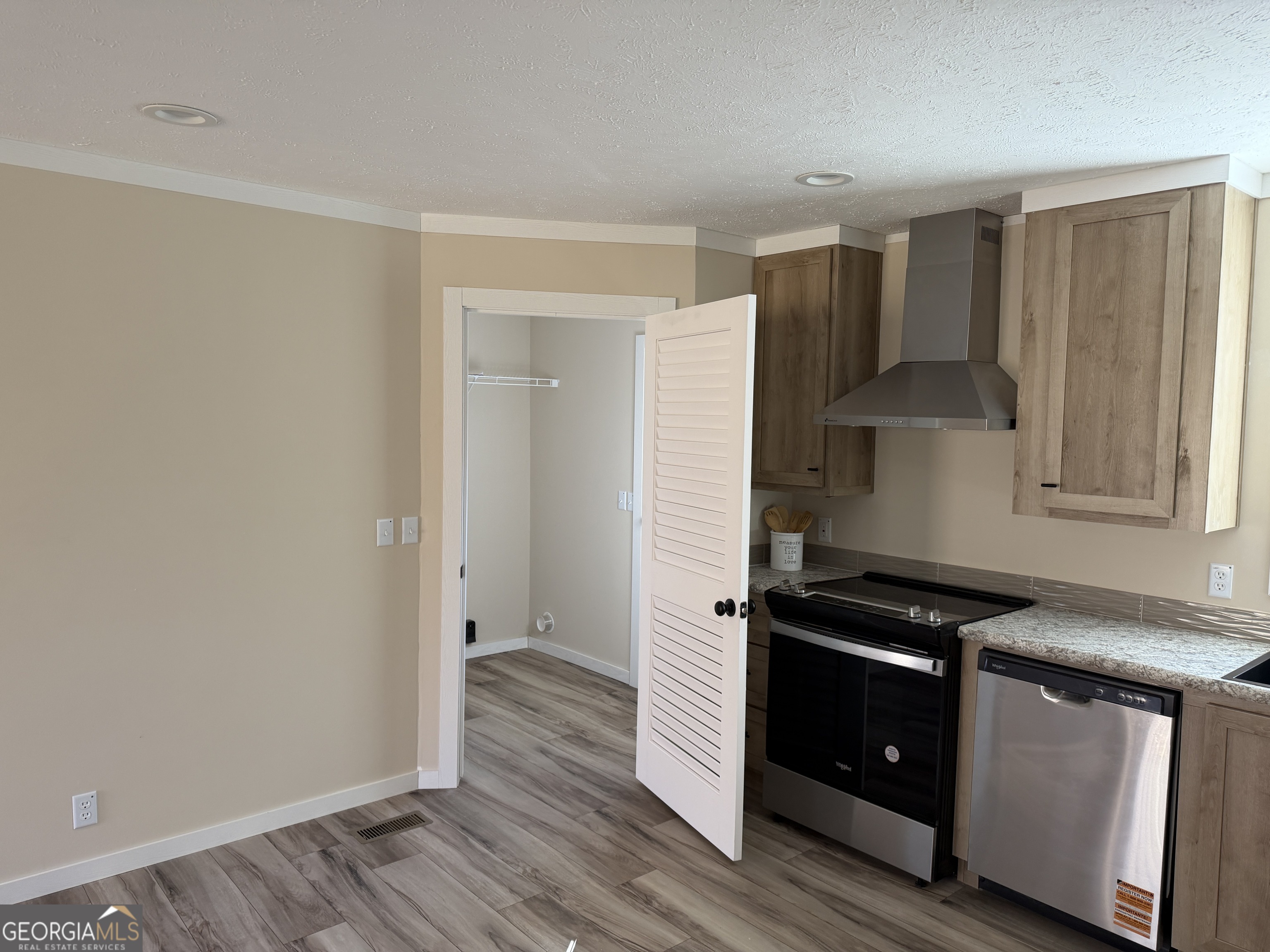 433 B C Grant Road Alto, GA 30510 - Photo 14 of 23 a kitchen with wooden cabinets and a stove top oven