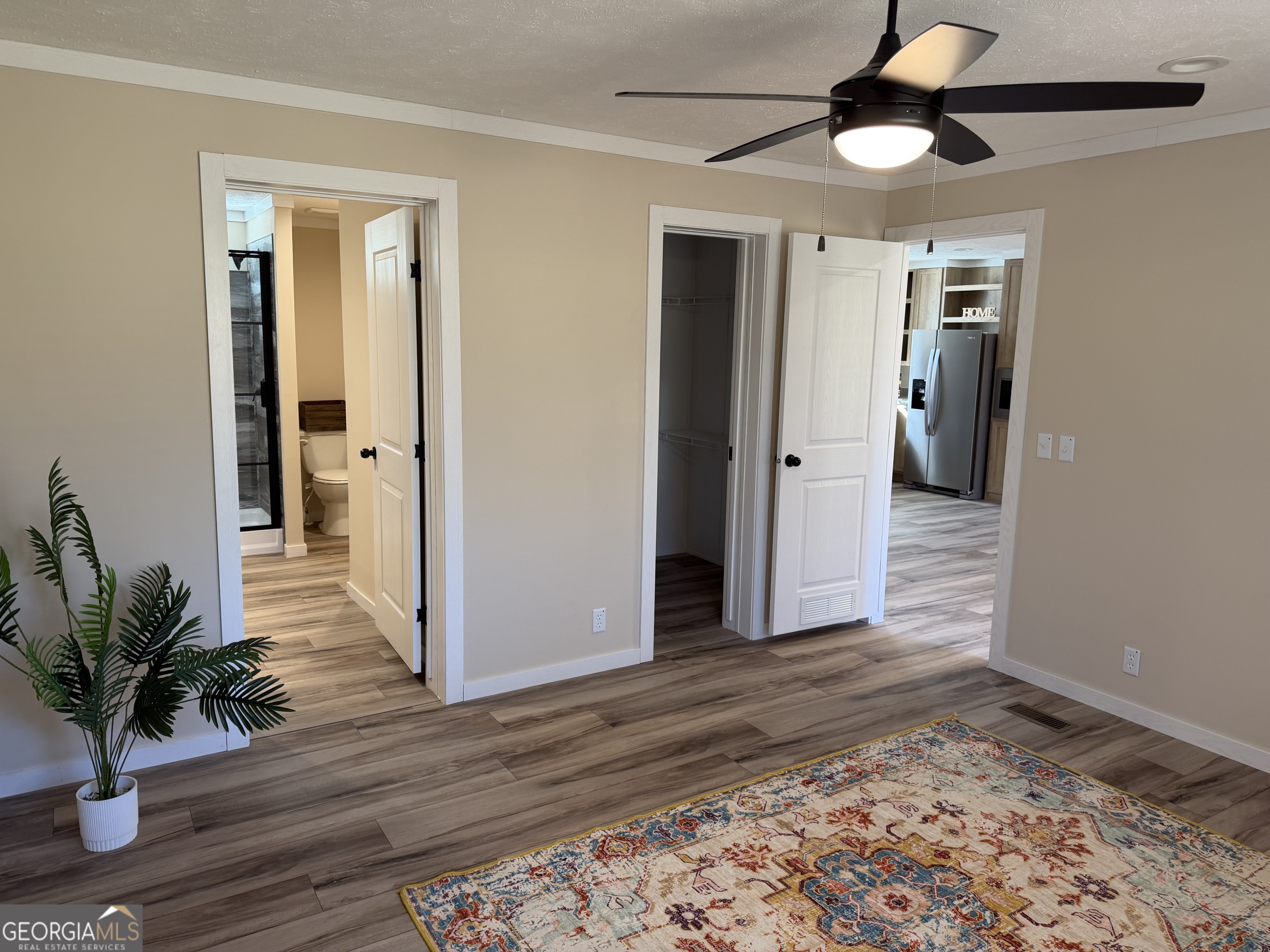 433 B C Grant Road Alto, GA 30510 - Photo 15 of 23 a view of a hallway with wooden floor and a ceiling fan