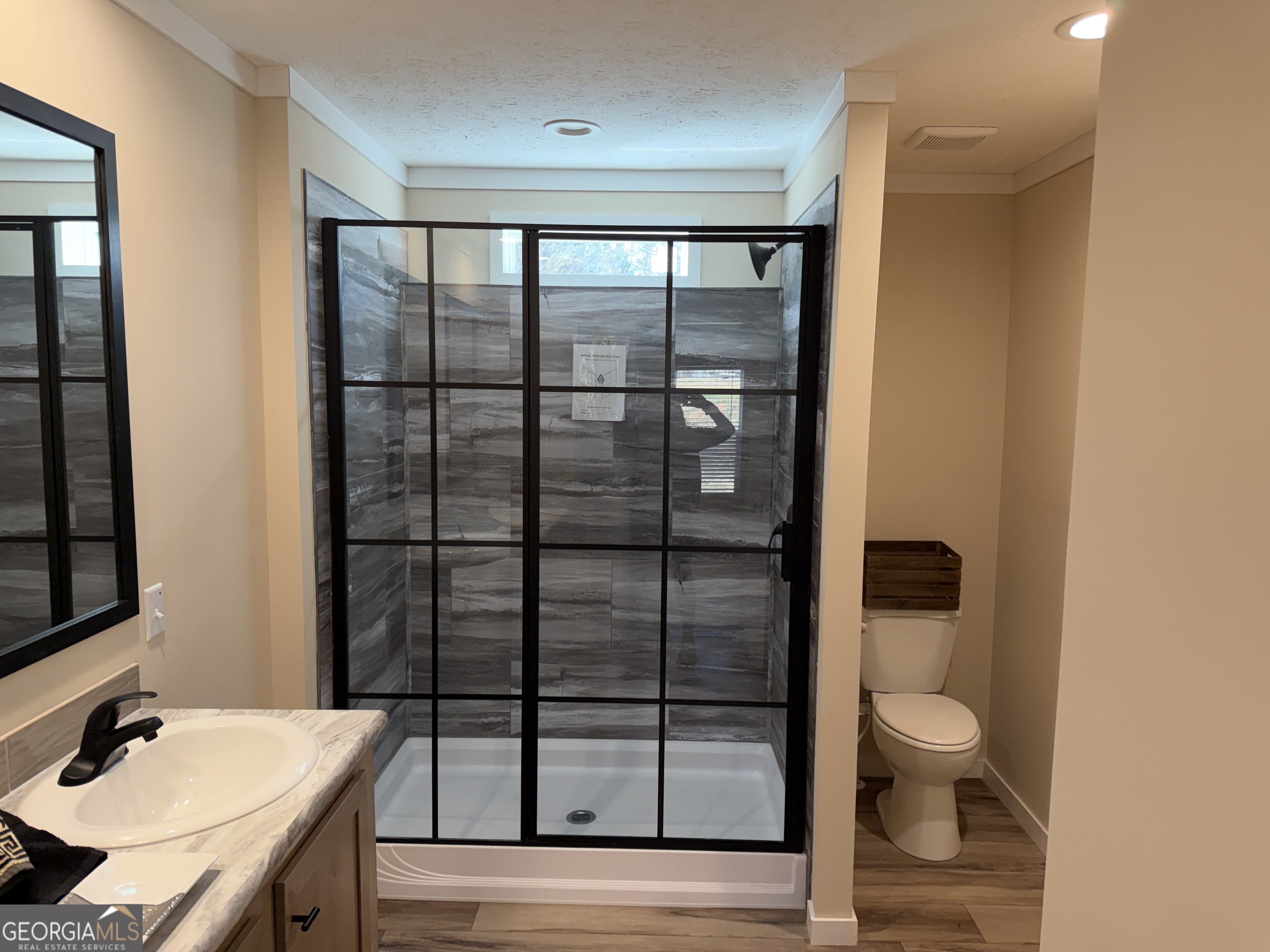 433 B C Grant Road Alto, GA 30510 - Photo 17 of 23 a bathroom with a granite countertop sink toilet and shower
