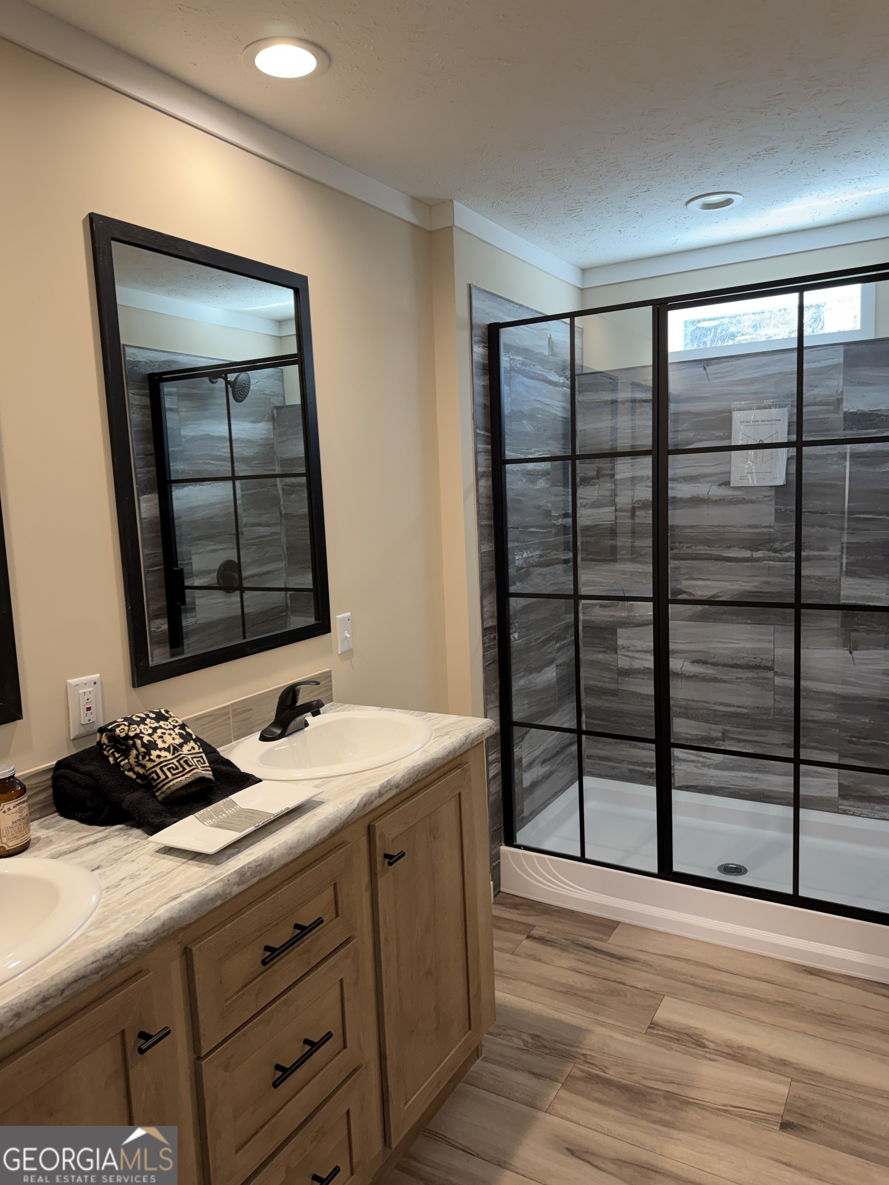 433 B C Grant Road Alto, GA 30510 - Photo 19 of 23 a bathroom with a granite countertop sink and a window