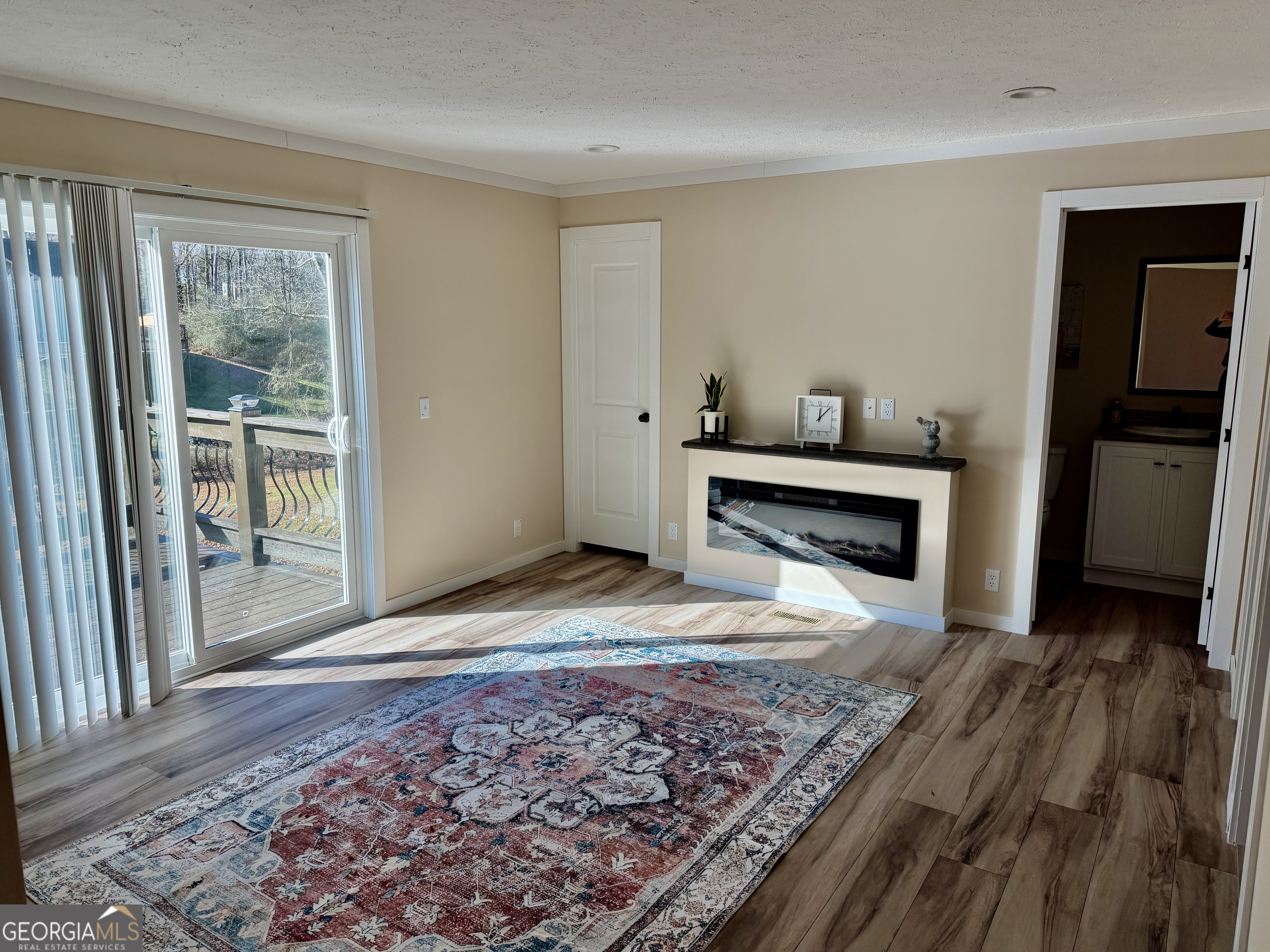 433 B C Grant Road Alto, GA 30510 - Photo 20 of 23 a view of a livingroom with wooden floor and a fireplace