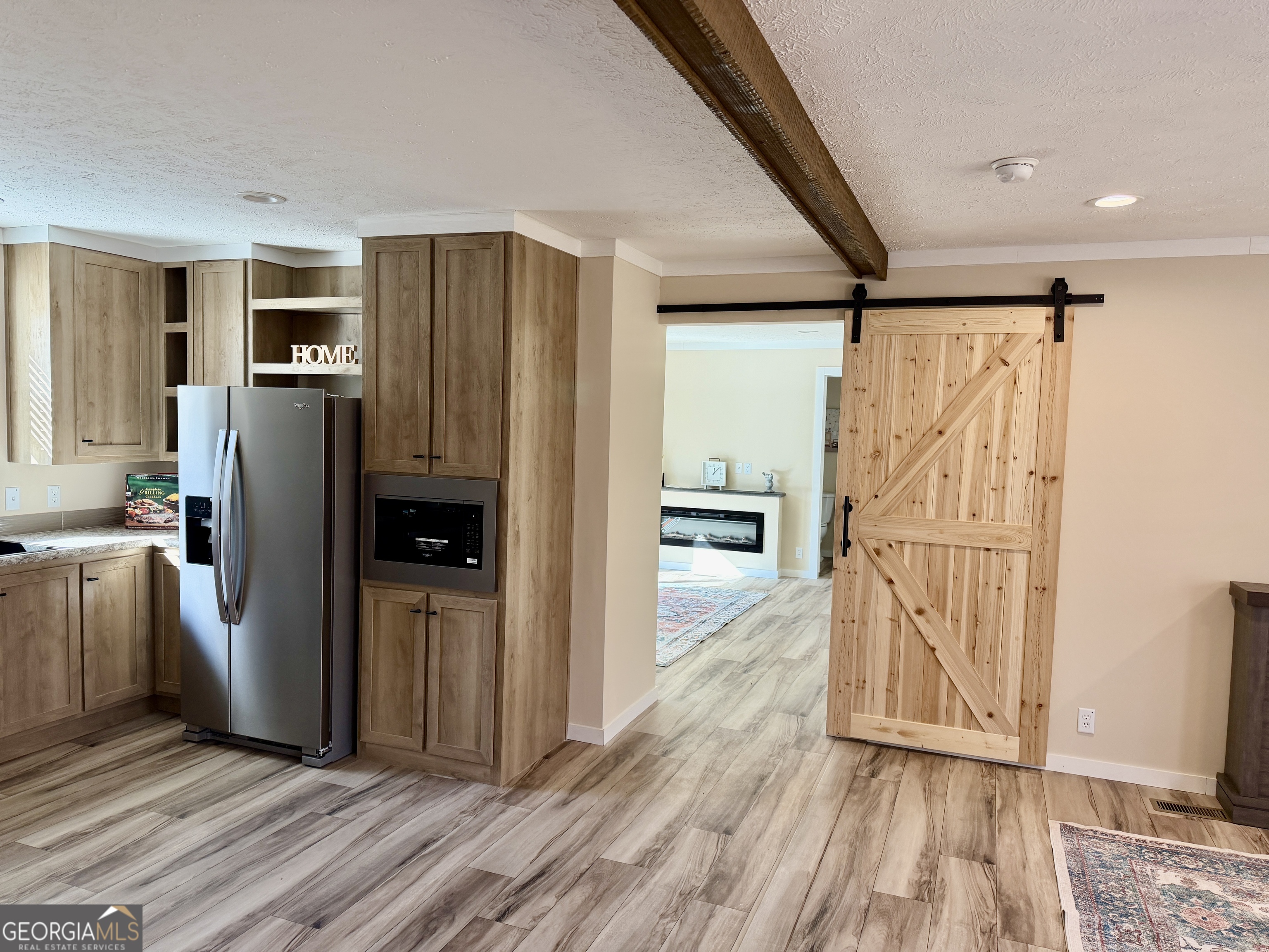 433 B C Grant Road Alto, GA 30510 - Photo 10 of 23 a view of a kitchen with refrigerator and wooden floor