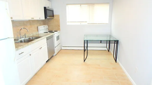 a hallway with cabinets