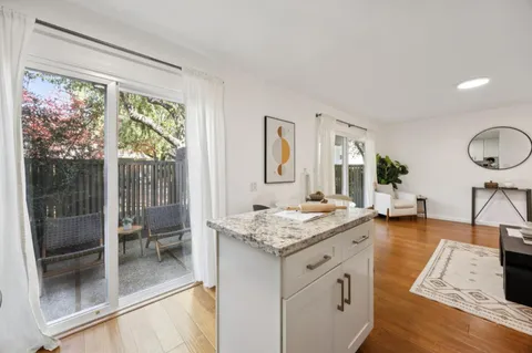 a view of living room with granite countertop furniture and fireplace