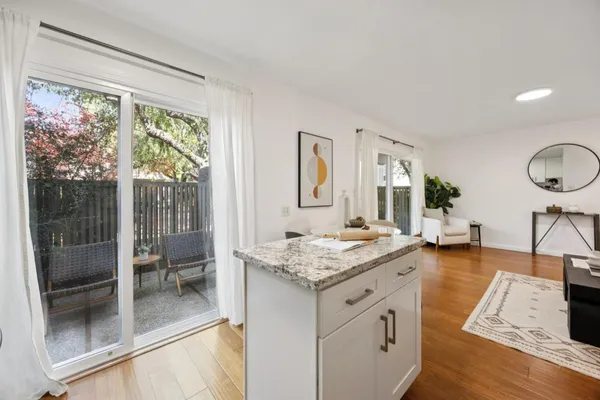 a view of living room with granite countertop furniture and fireplace
