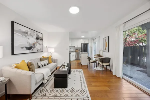 a living room with furniture and a large window
