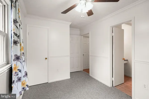 a bathroom with a toilet sink and vanity
