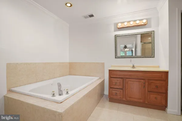 a bathroom with a shower and a glass door