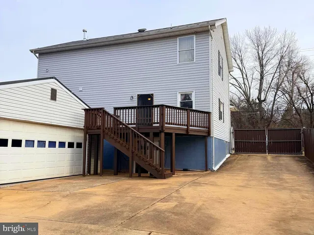 a front view of a house with a fence
