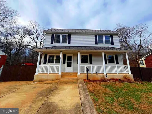 a house with garden in front of it