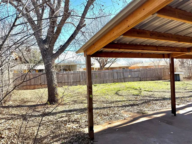 a view of a backyard of the house