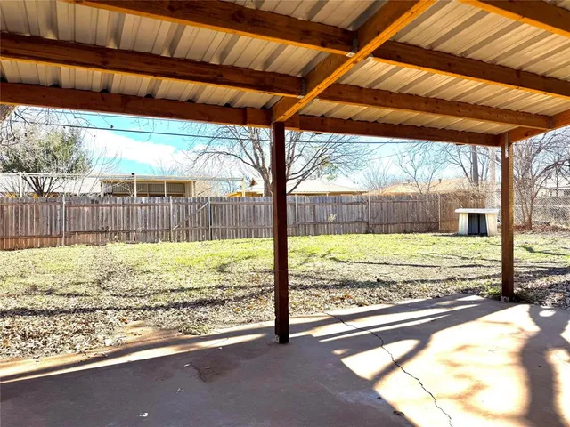 a view of a room with wooden floor and a swimming pool