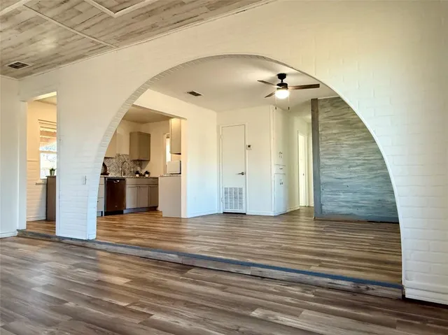 a view of a livingroom with wooden floor