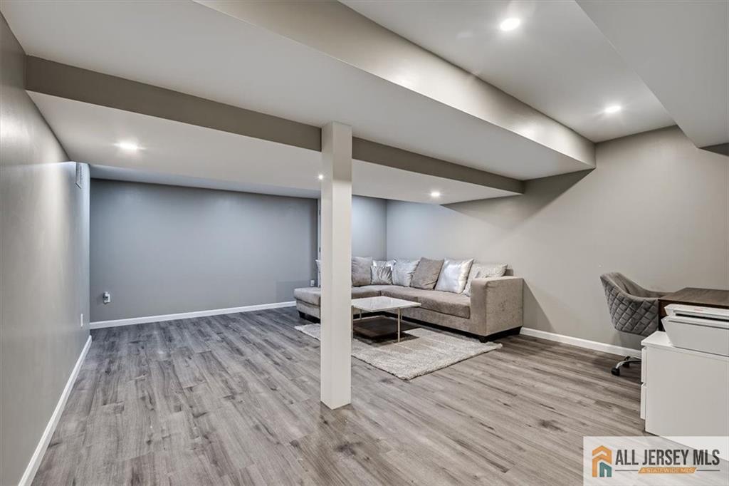 3003 Hana Road Edison, NJ 08817 - Photo 35 of 45 a living room with furniture and a wooden floor