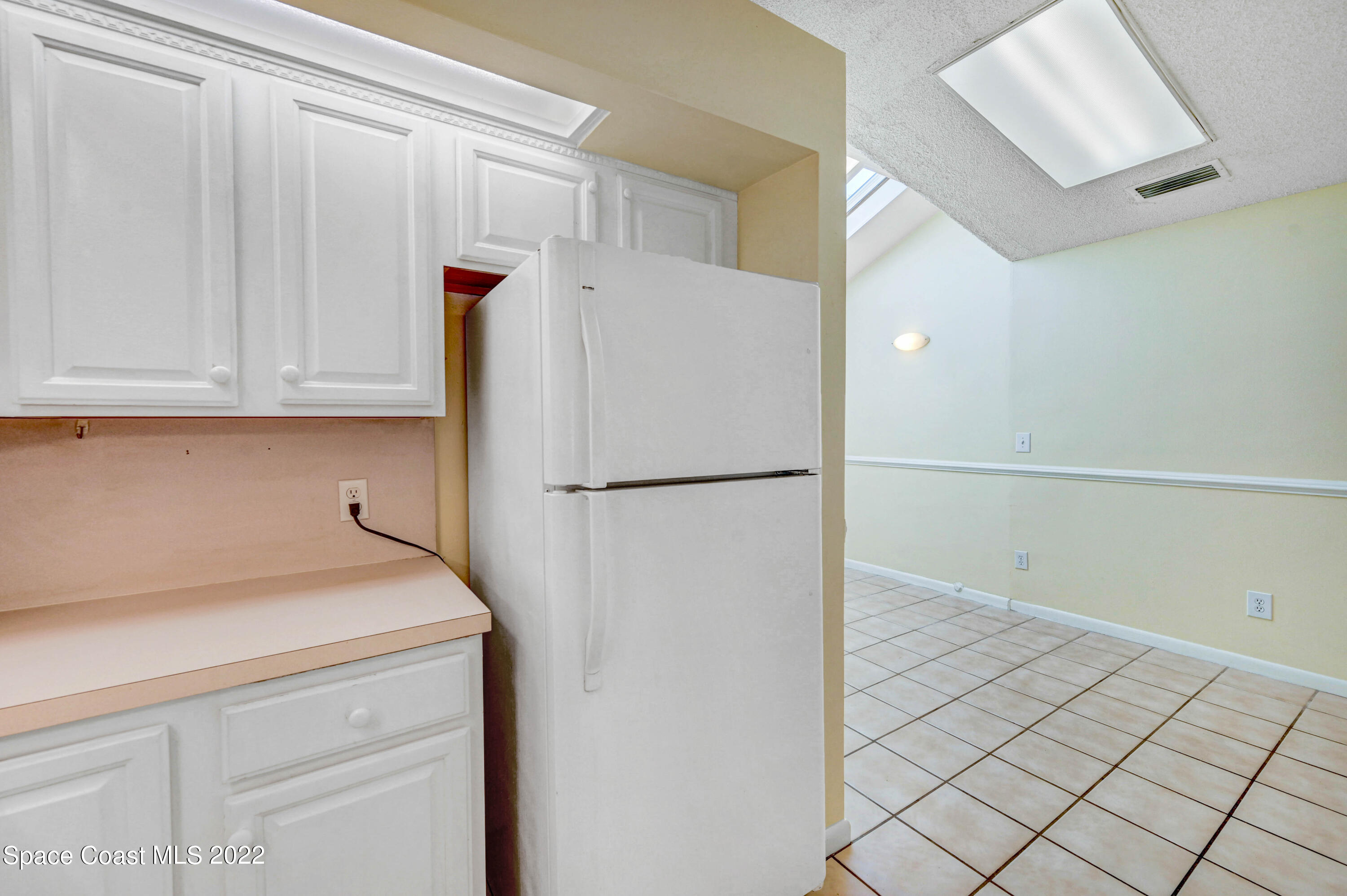 373 Myrtlewood Road Melbourne, FL 32940 - Photo 17 of 42 a view of a storage and utility room with washer and dryer