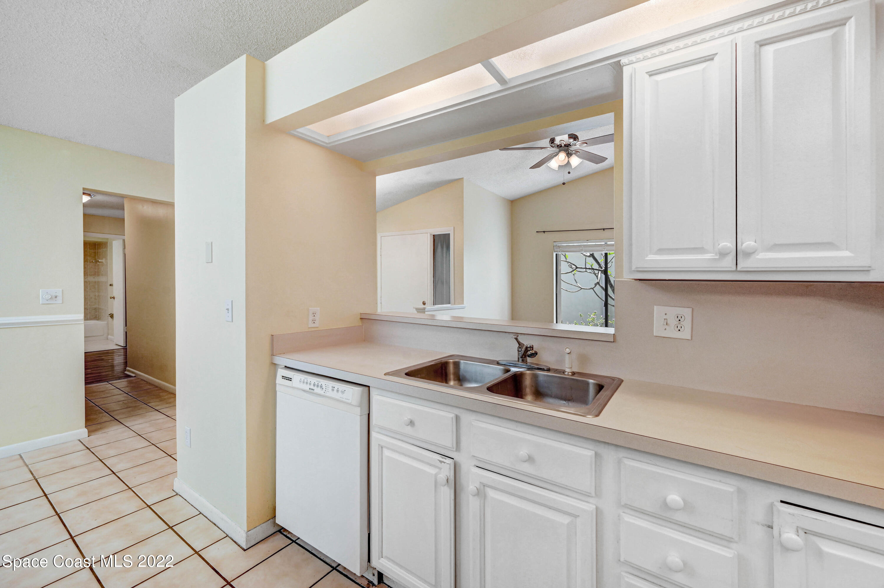 373 Myrtlewood Road Melbourne, FL 32940 - Photo 18 of 42 a kitchen with a sink and cabinets