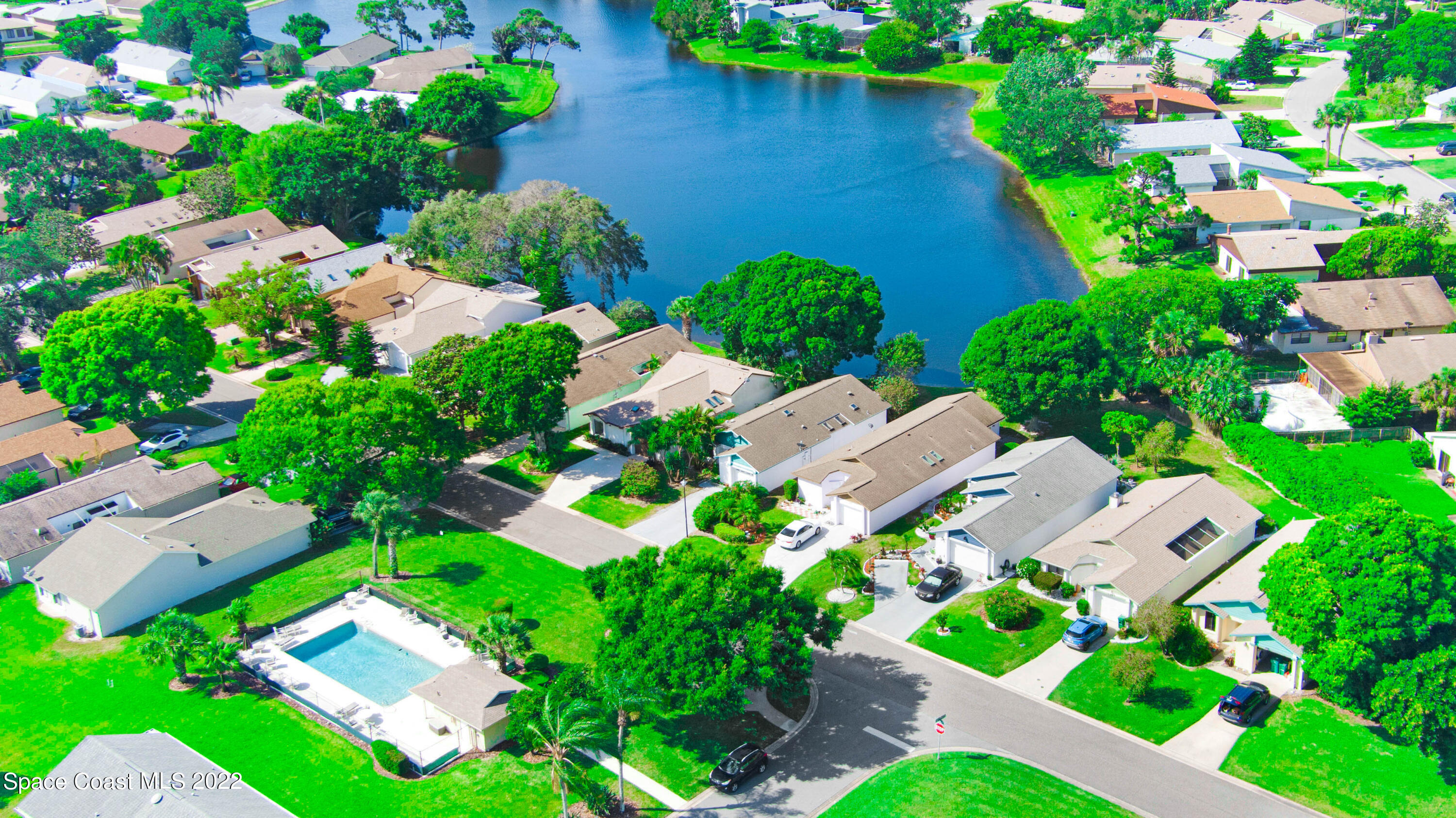 373 Myrtlewood Road Melbourne, FL 32940 - Photo 32 of 42 an aerial view of residential house with outdoor space and lake view in back yard