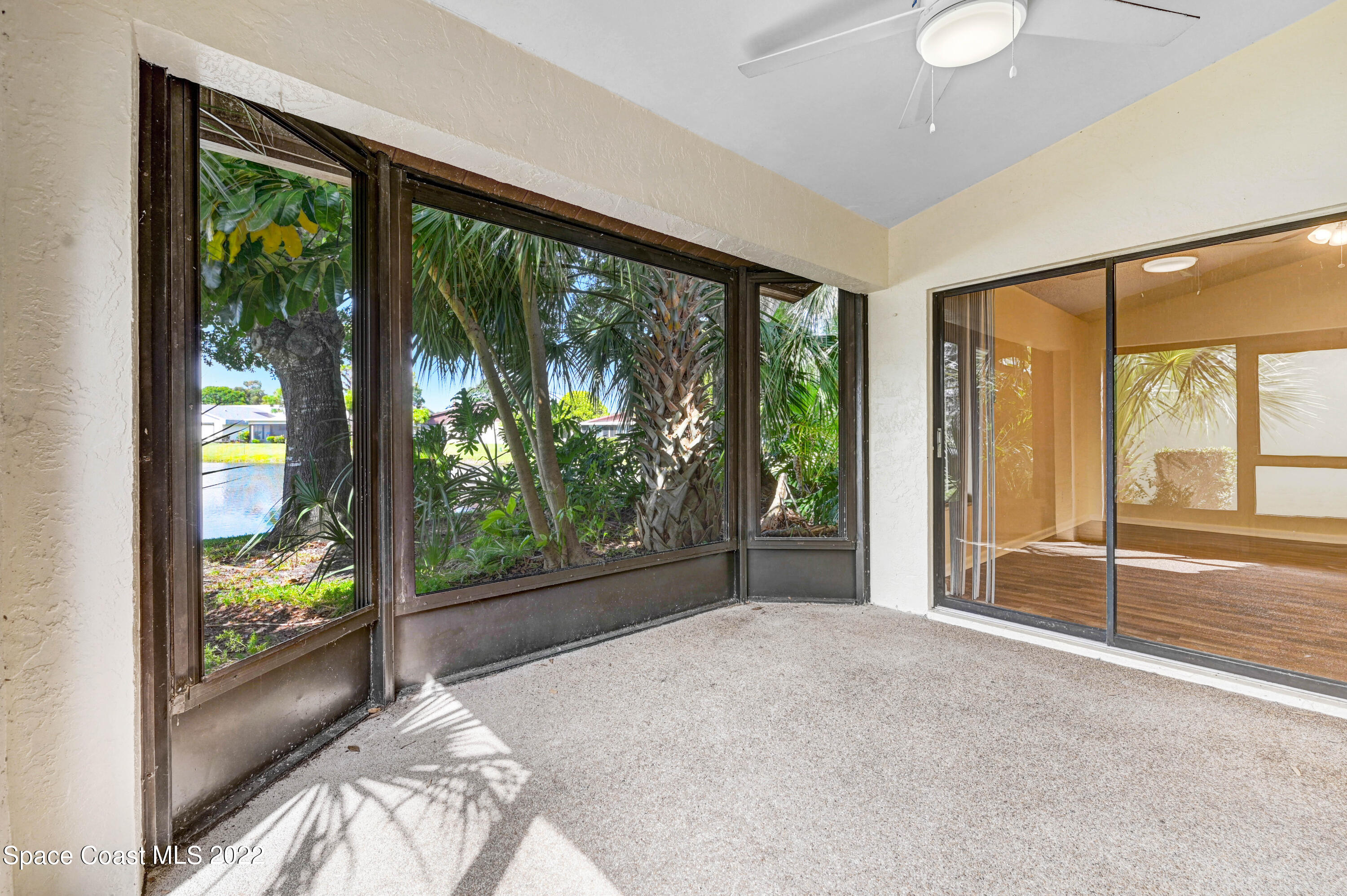 373 Myrtlewood Road Melbourne, FL 32940 - Photo 7 of 42 a view of a room with large windows and pool table