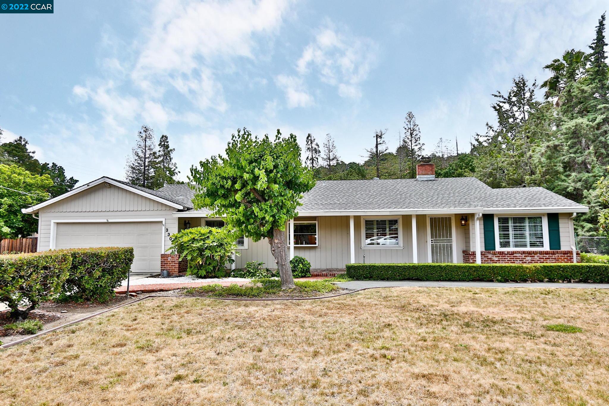 3300 Cowell Road Concord, CA 94518 - Photo 1 of 1 a front view of a house with a garden
