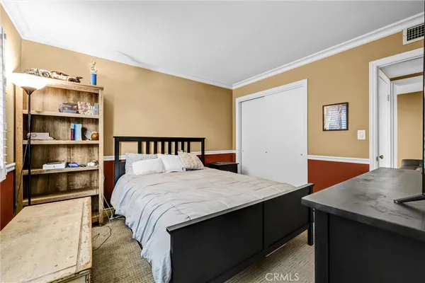 a bedroom with a bed and a table in it