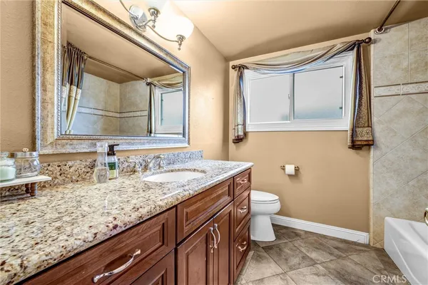 a white bath tub sitting next to a white sink