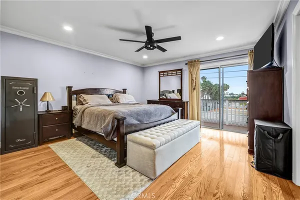 a bed room with a bed and a television