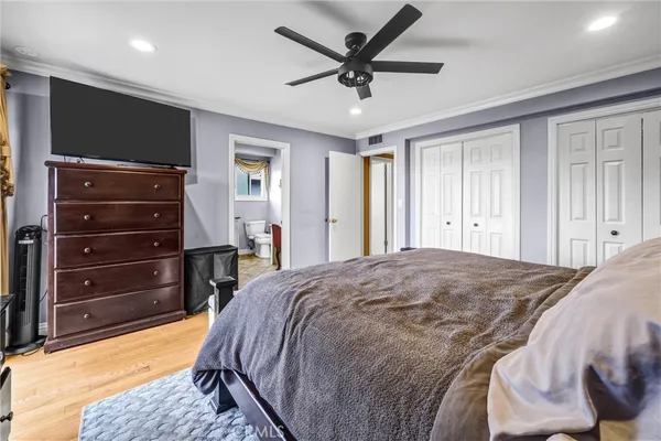 a spacious bathroom with double vanity and a shower