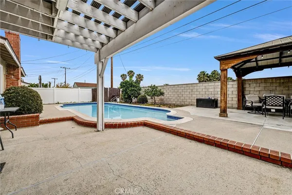 a view of a swimming pool with a porch