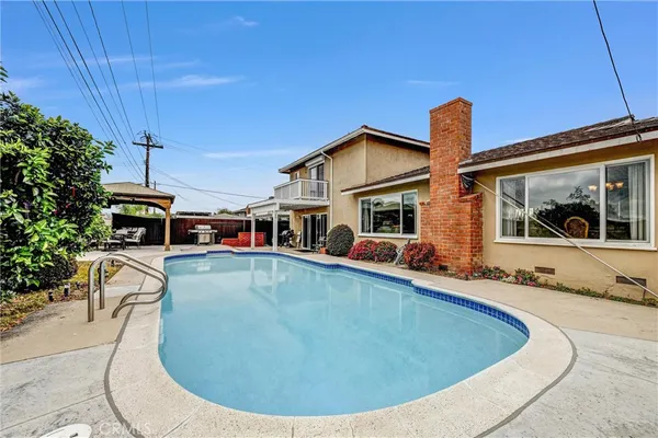 a view of a patio with table and chairs