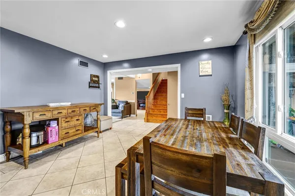 a kitchen with stainless steel appliances granite countertop a stove and a refrigerator