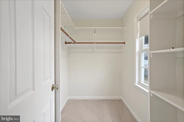 a view of an empty walk in closet