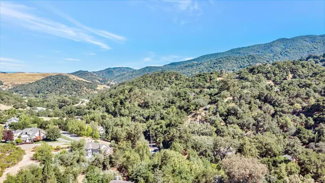 a view of a large mountain with mountains in the background