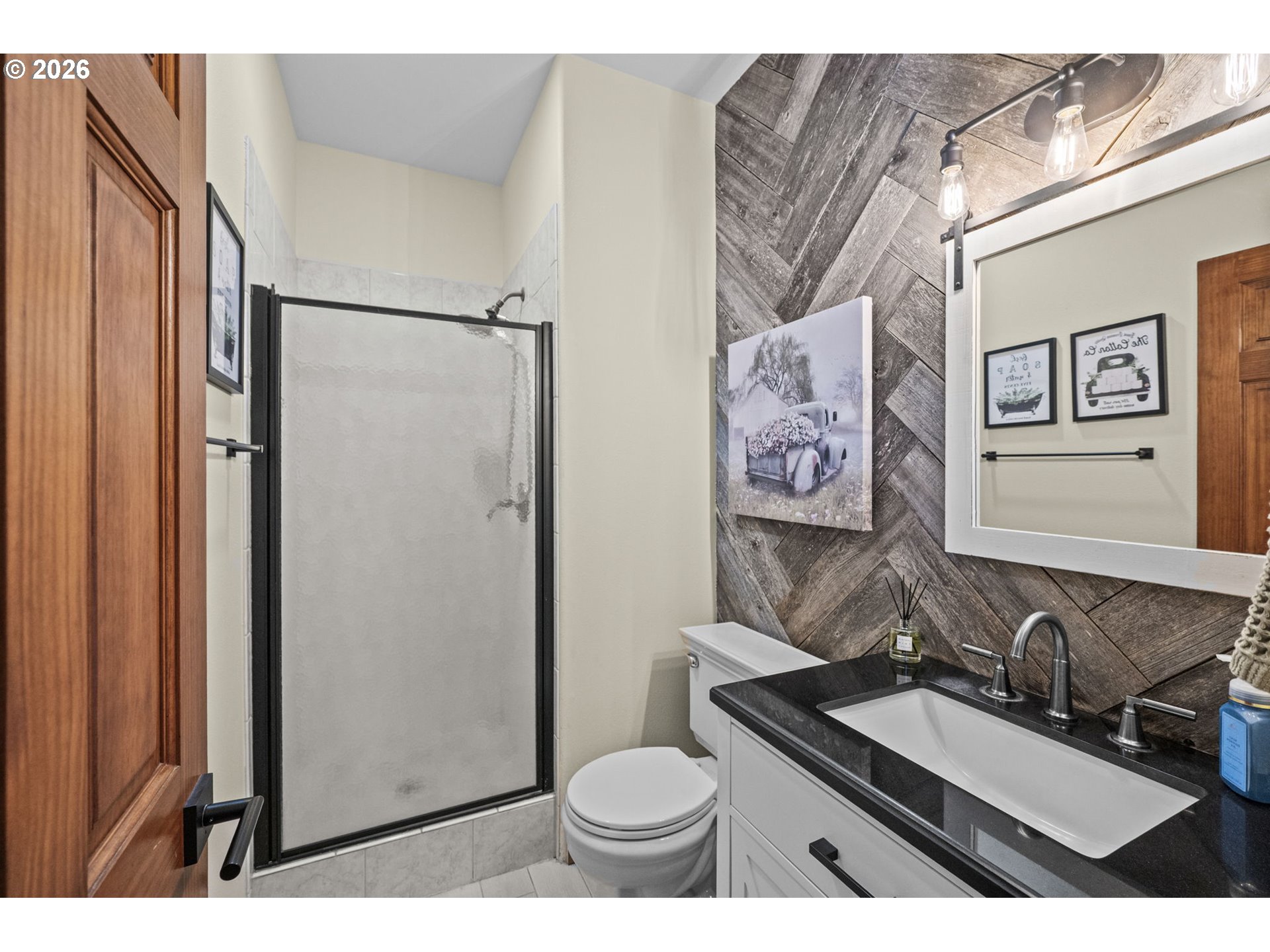 33246 South Wilhoit Road Molalla, OR 97038 - Photo 15 of 48 a bathroom with a granite countertop toilet sink and mirror
