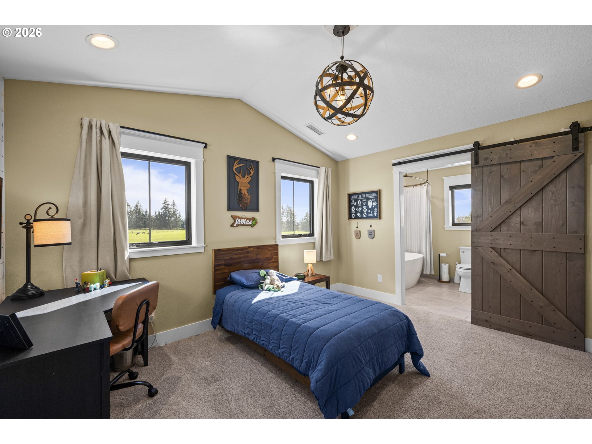 33246 South Wilhoit Road Molalla, OR 97038 - Photo 19 of 48 a bedroom with a bed and a table in it