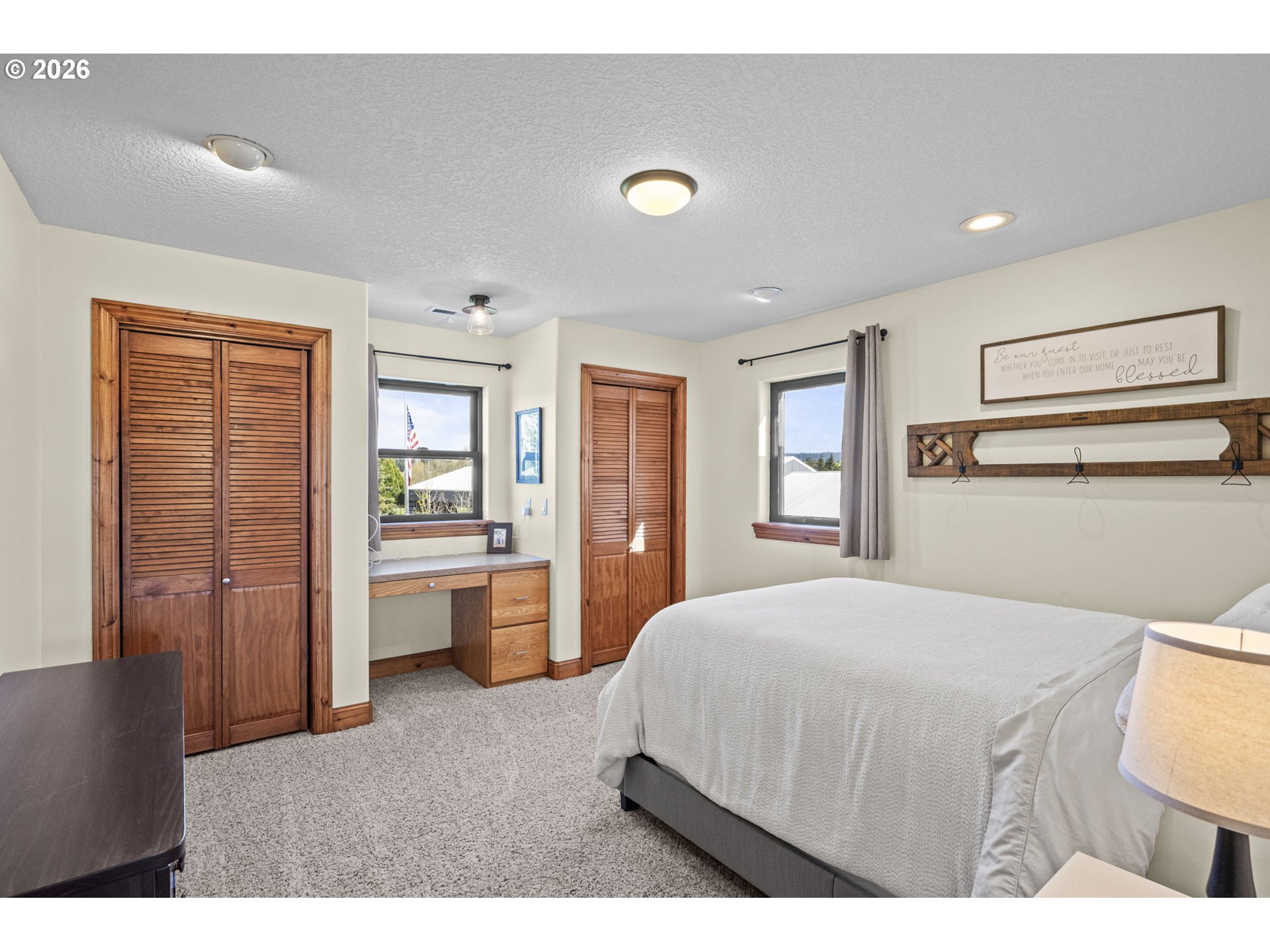 33246 South Wilhoit Road Molalla, OR 97038 - Photo 21 of 48 a bedroom with a bed and wooden floor