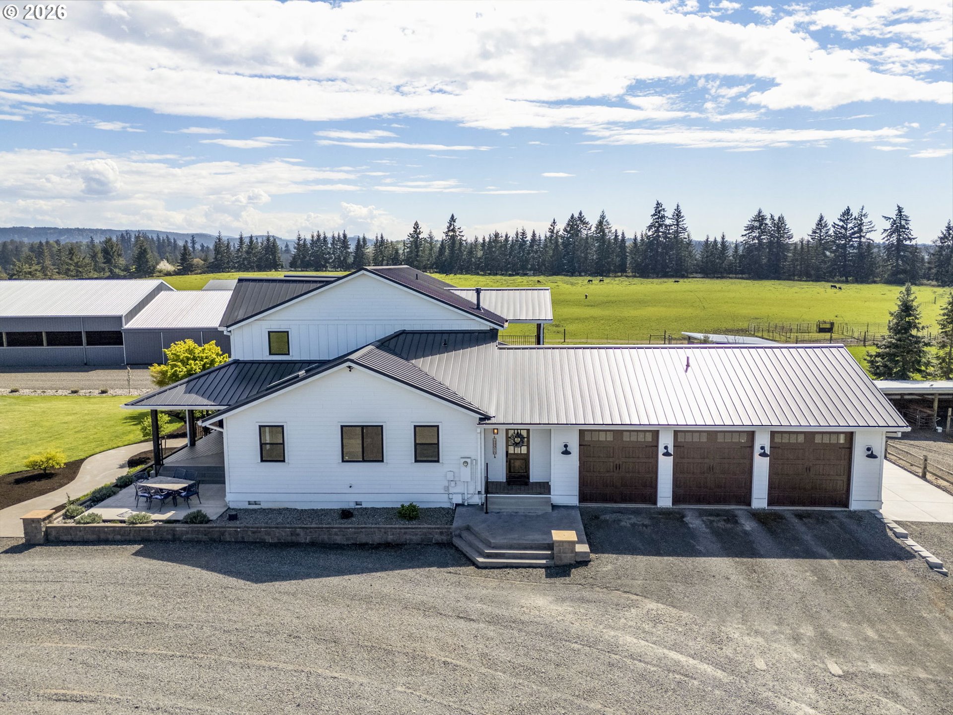 33246 South Wilhoit Road Molalla, OR 97038 - Photo 3 of 48 a view of a house with swimming pool and sitting area