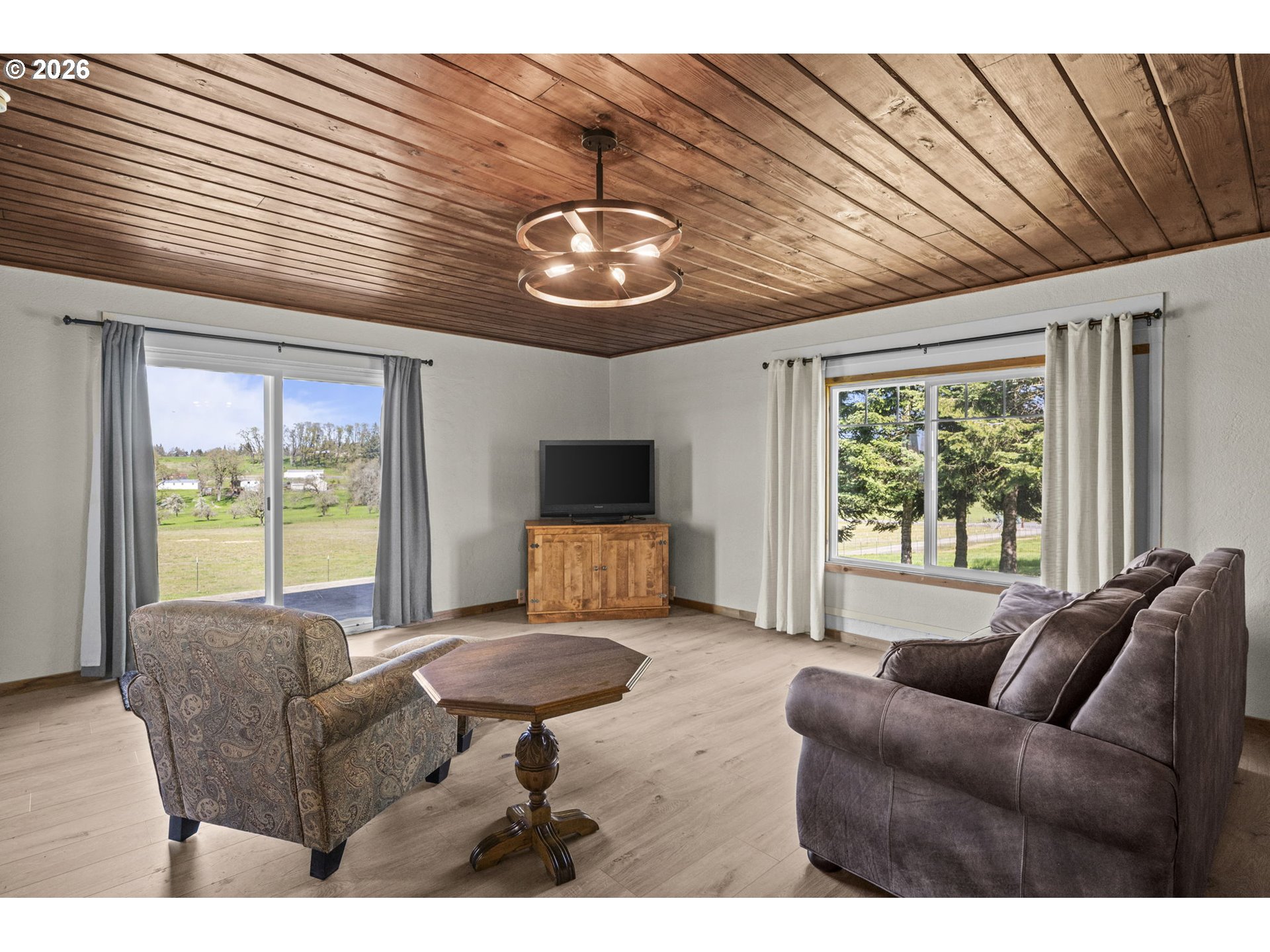 33246 South Wilhoit Road Molalla, OR 97038 - Photo 42 of 48 a living room with furniture a flat screen tv and a large window