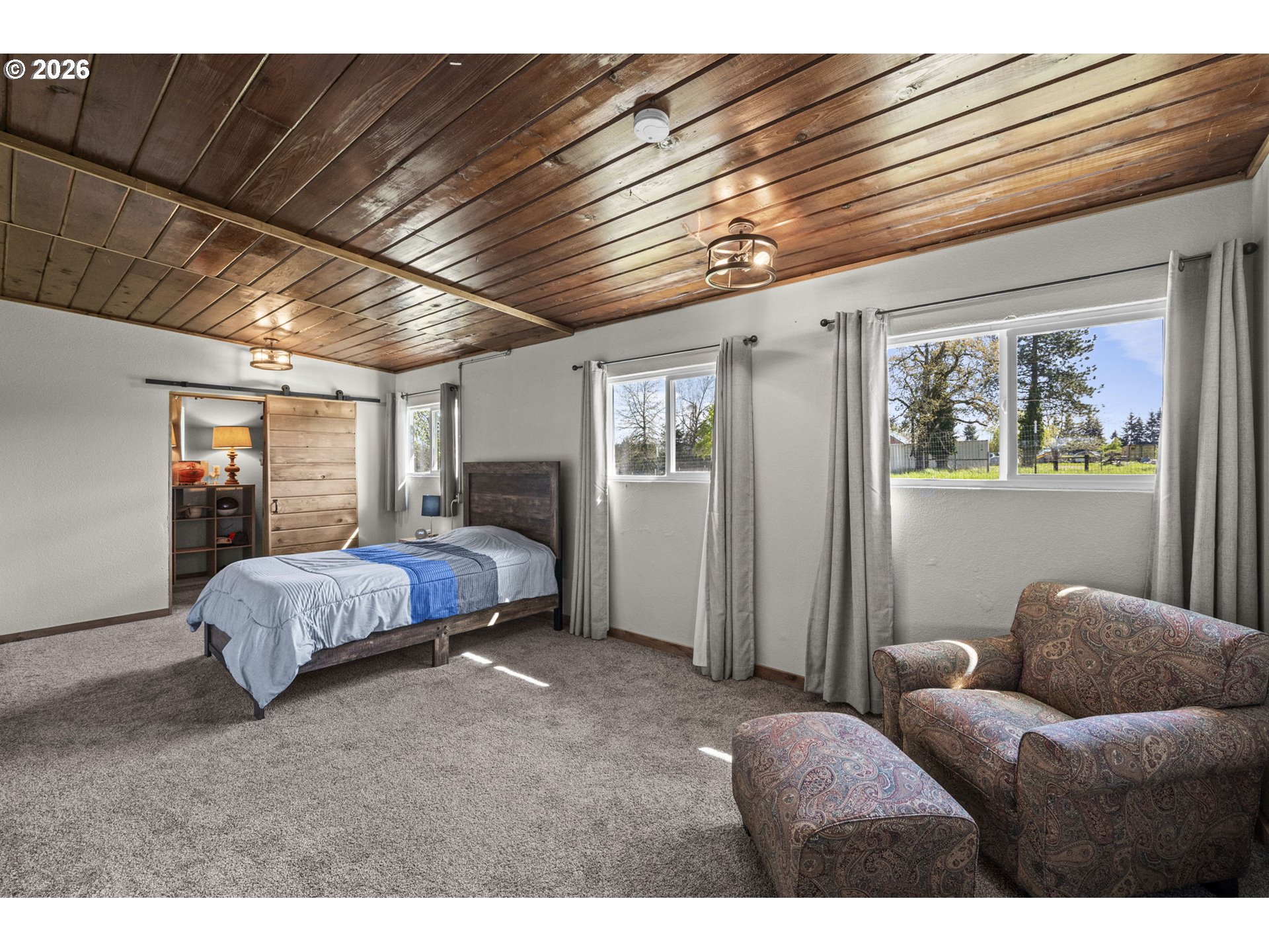 33246 South Wilhoit Road Molalla, OR 97038 - Photo 44 of 48 a spacious bedroom with a bed window and couch