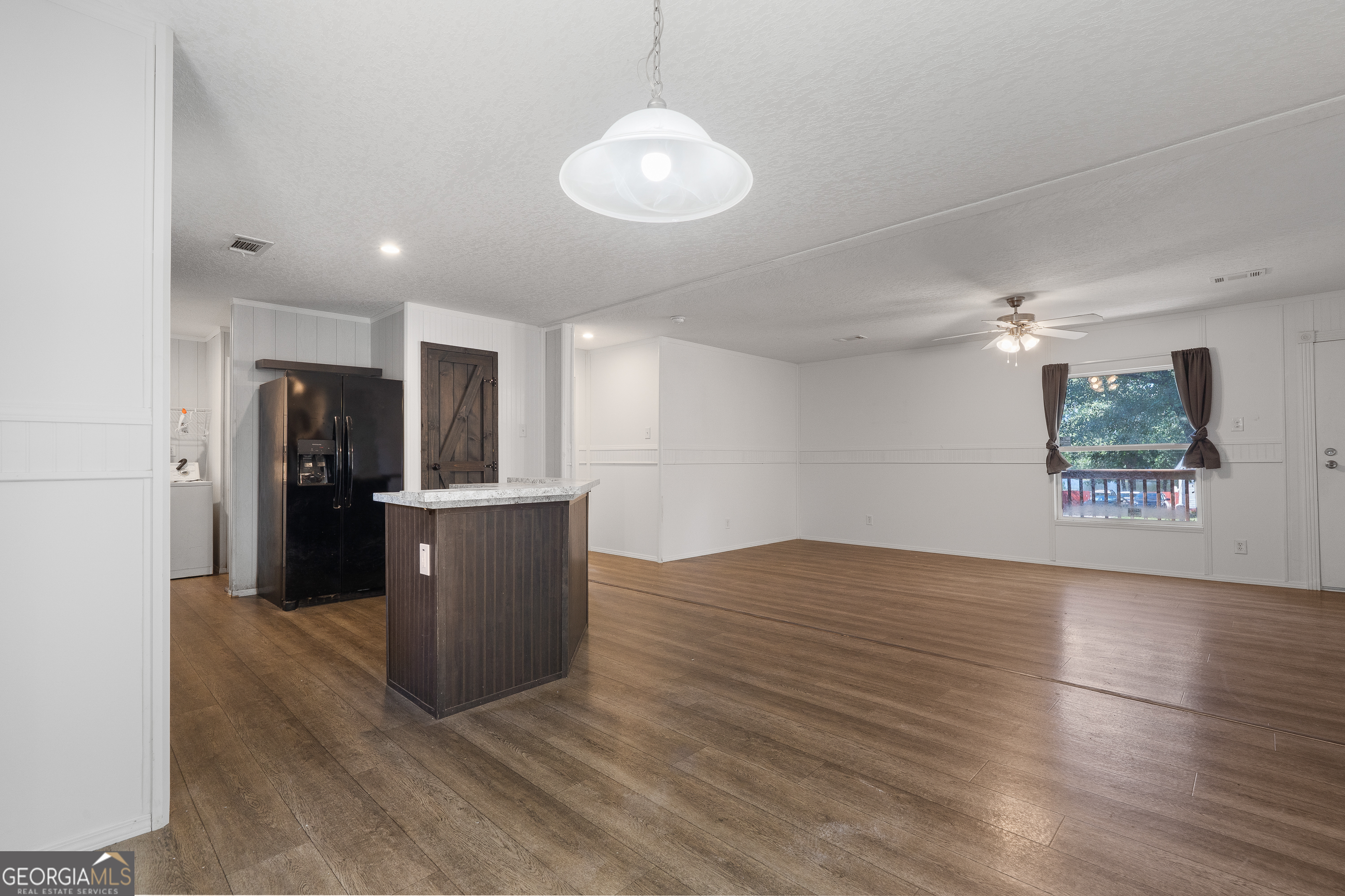 280 Lakeview Drive Locust Grove, GA 30248 - Photo 11 of 43 a view of a kitchen with a sink and a refrigerator