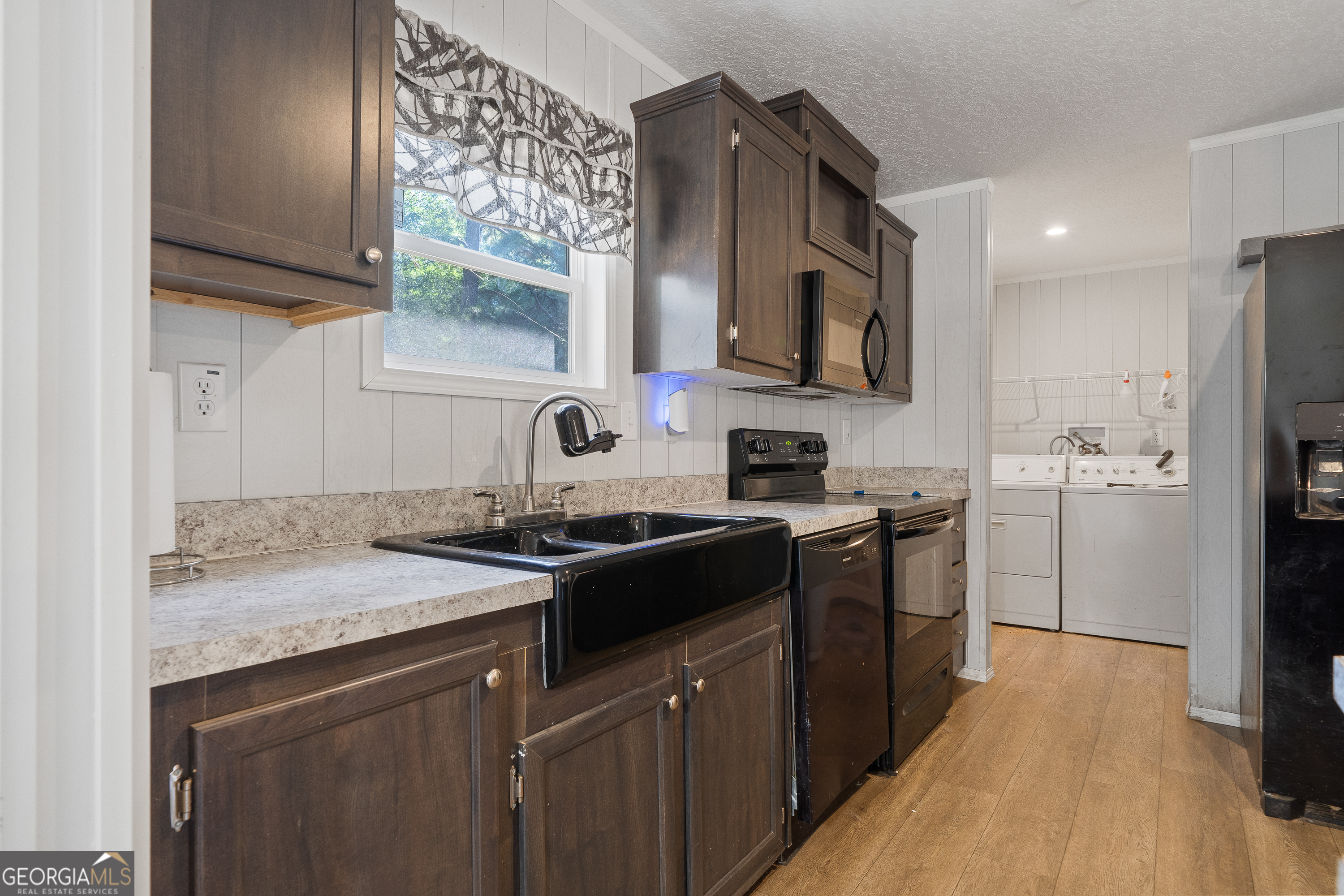 280 Lakeview Drive Locust Grove, GA 30248 - Photo 13 of 43 a kitchen with stainless steel appliances granite countertop a sink stove and refrigerator