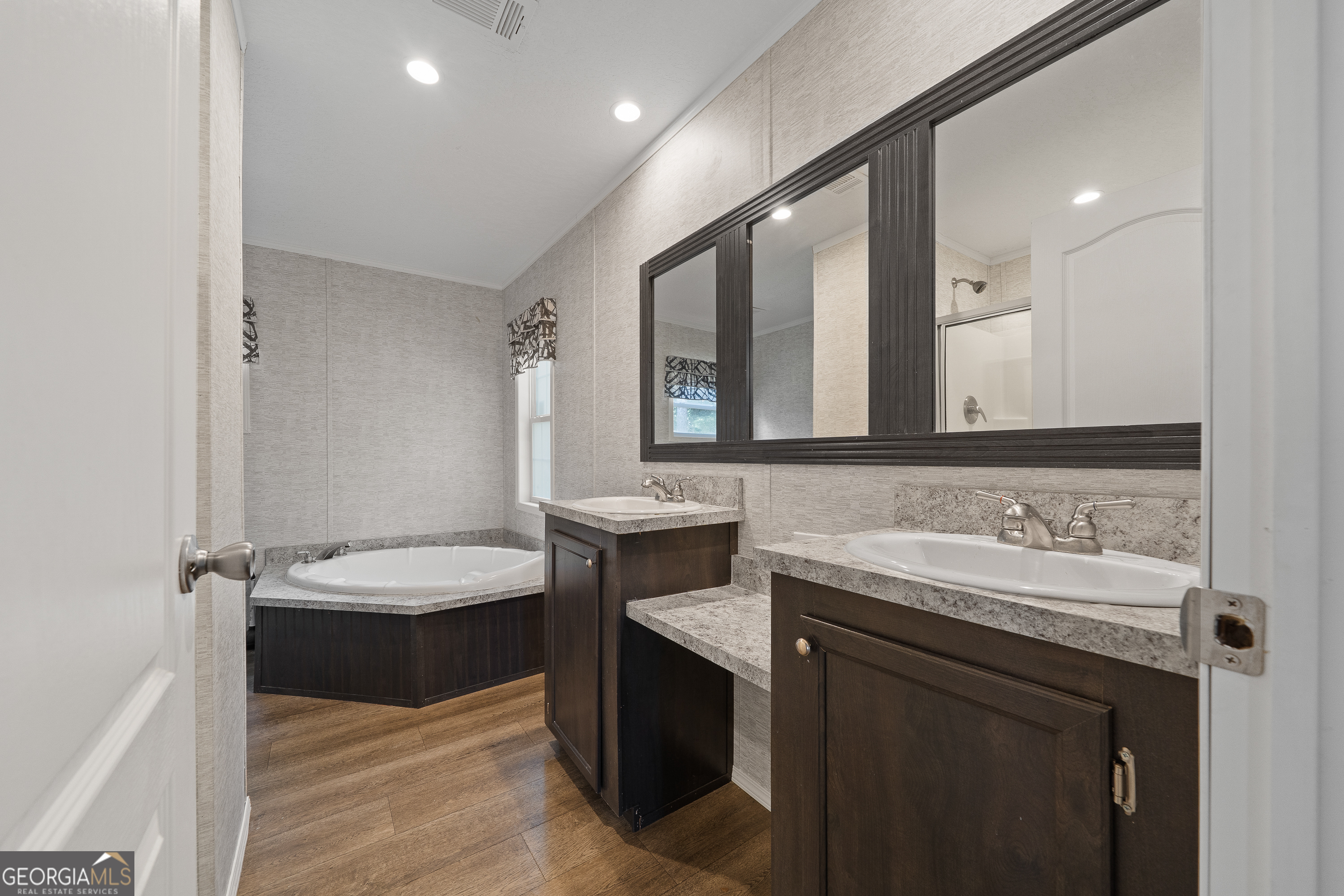 280 Lakeview Drive Locust Grove, GA 30248 - Photo 26 of 43 a bathroom with a double vanity sink and a mirror