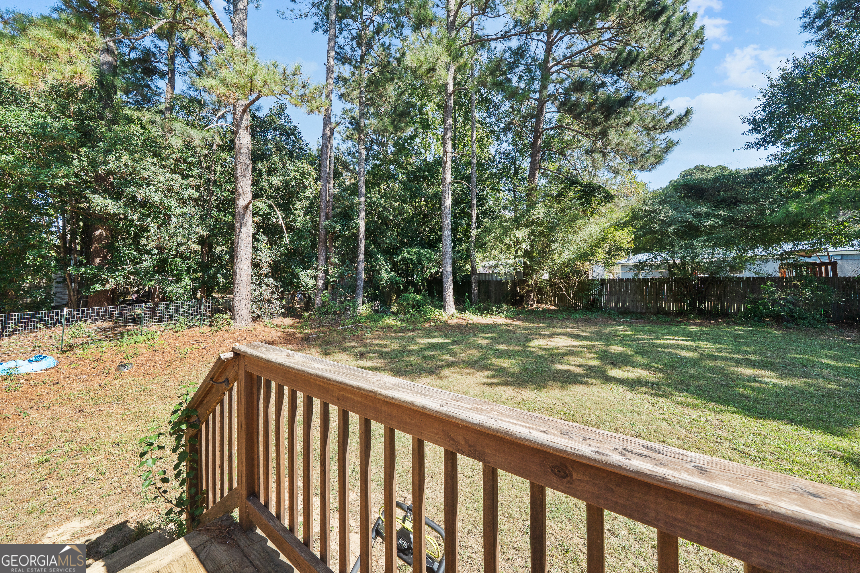 280 Lakeview Drive Locust Grove, GA 30248 - Photo 29 of 43 a view of a wooden fence and a yard