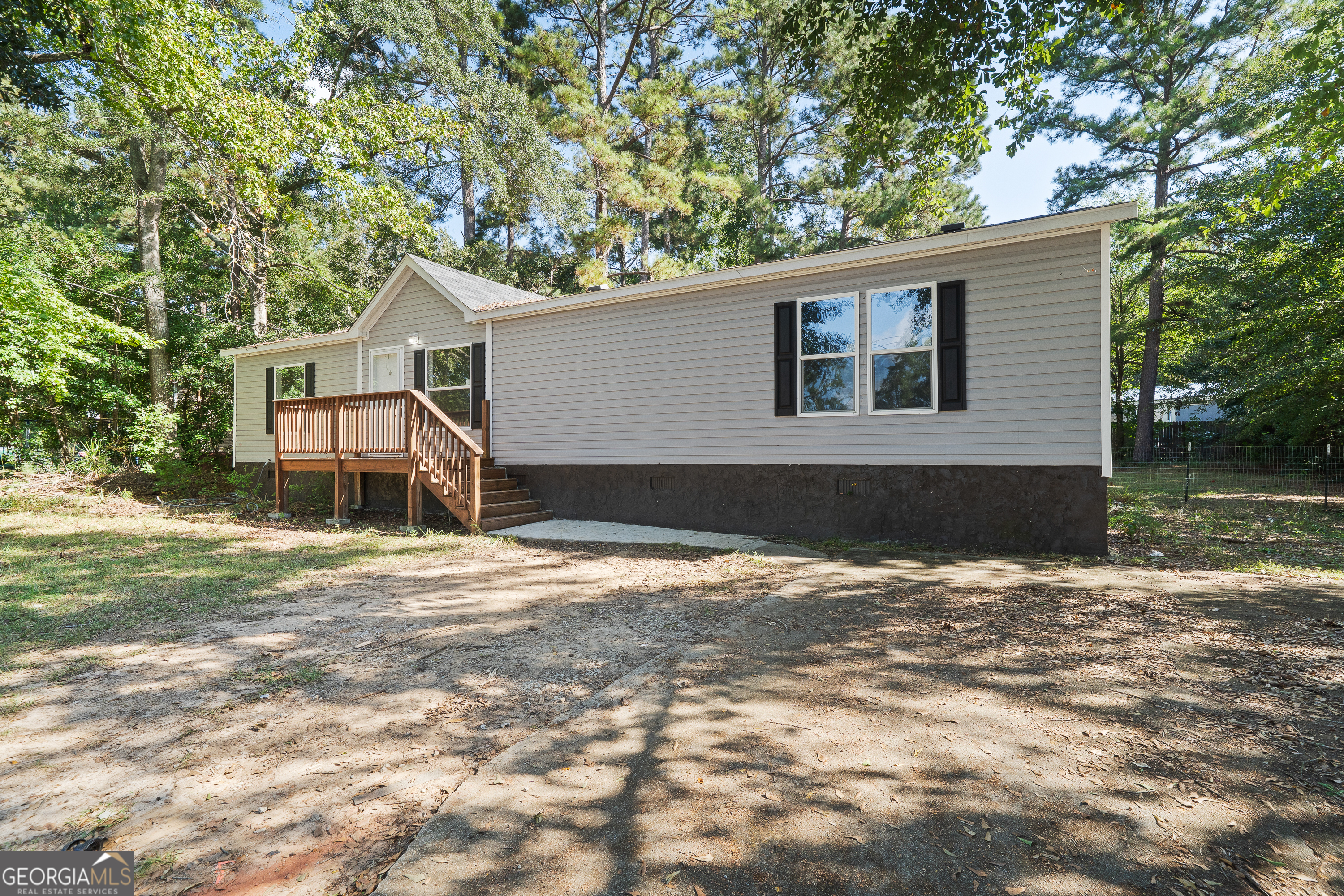 280 Lakeview Drive Locust Grove, GA 30248 - Photo 31 of 43 a view of a house with a yard