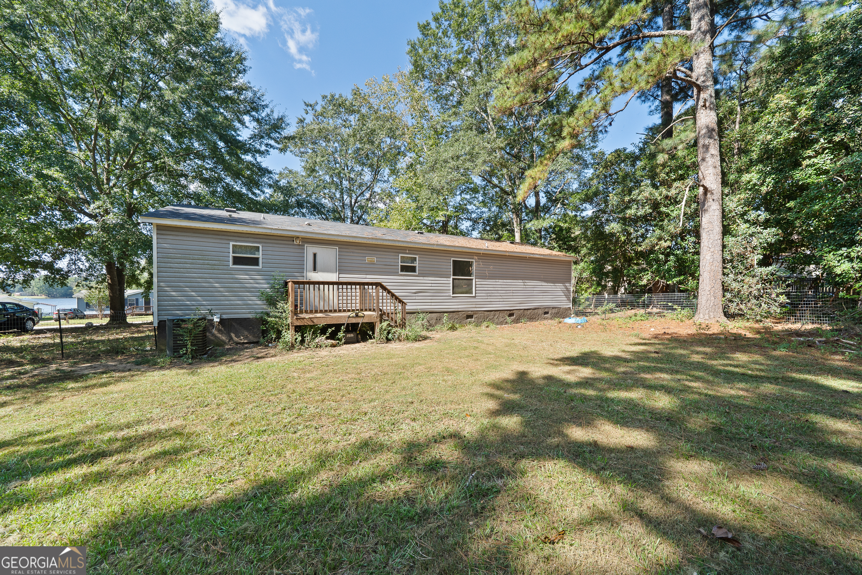 280 Lakeview Drive Locust Grove, GA 30248 - Photo 32 of 43 a view of a house with a yard